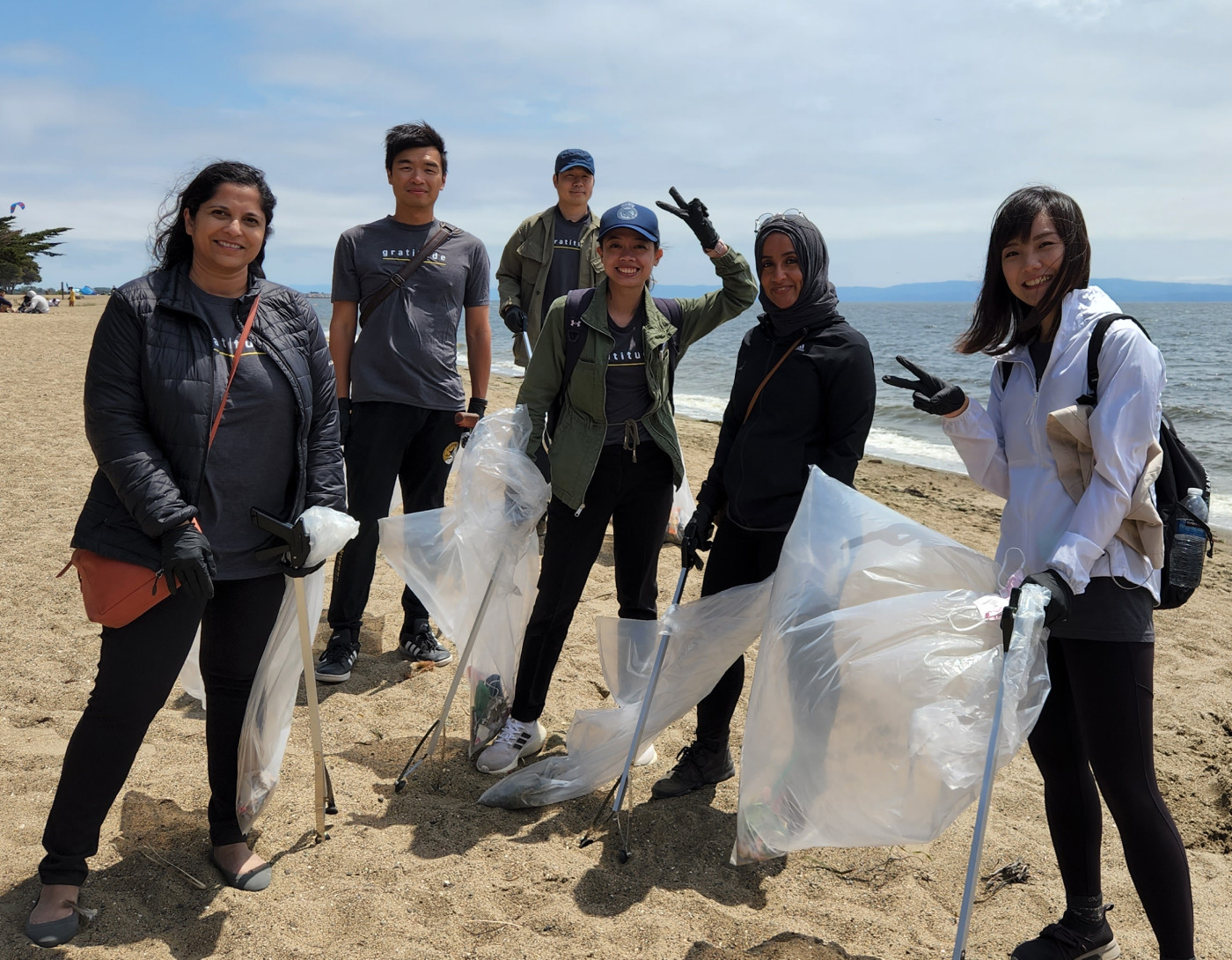Flad Architects staff volunteer beach cleanup activity