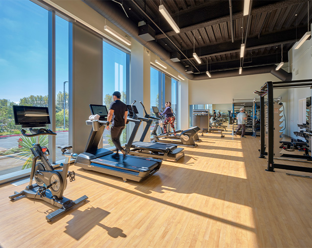 People exercising in onsite fitness center