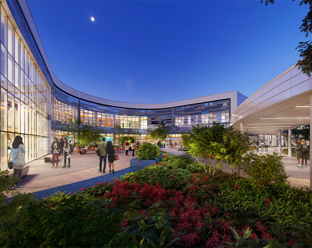 Government Hospitals and Health Facilities Corporation - Governor Juan F. Luis Hospital and Medical Center: Exterior view of ground level entrance with gardens and people